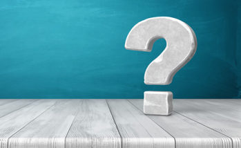3d rendering of a grey-white question mark made of stone standing on a wooden table on blue background.
